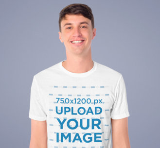 T-Shirt Mockup of a Smiling Man Standing in a Studio