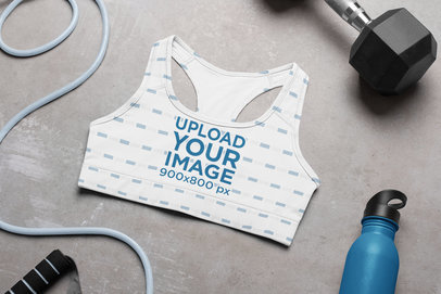 Mockup of a Sports Bra Surrounded by Fitness Accessories 