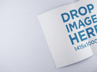 Open Booklet Mockup Lying on a Solid Color Surface a15082