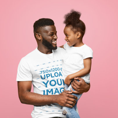 T-Shirt Mockup of a Happy Dad Carrying His Daughter at a Studio
