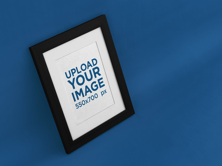 Angled Framed Art Print Mockup on a Solid Color Wall