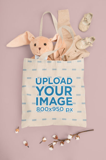 Mockup of a Tote Bag Filled With Baby Stuff