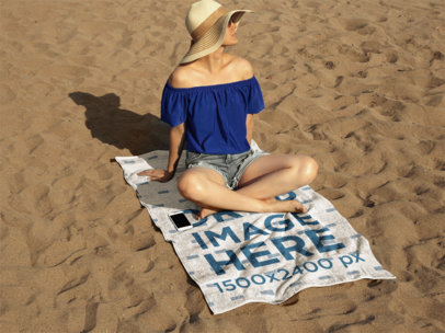 Young Lady Sitting on a Towel Mockup While at the Beach a14891