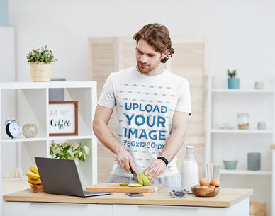 T-Shirt Mockup of a Man Watching a Cooking Tutorial