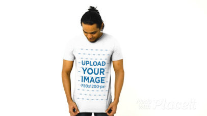 T-Shirt Video of a Man Posing in a Studio with Plain Background