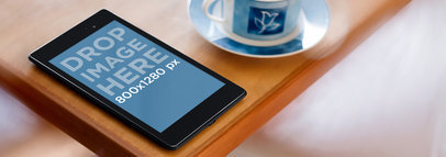 Mockup of a Nexus 7 in Portrait Position over a Wooden Table