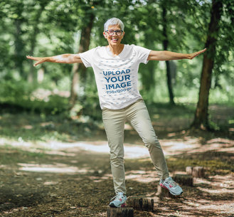 T-Shirt Mockup of a Senior Woman Having Fun in the Forest