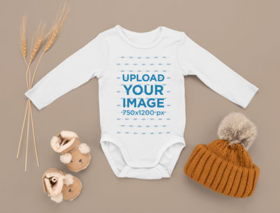 Mockup Featuring a Customizable Onesie Surrounded by Other Baby Garments m1133