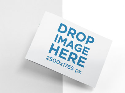 Mockup of a Closed Booklet Lying on a Two Colors Surface a15136