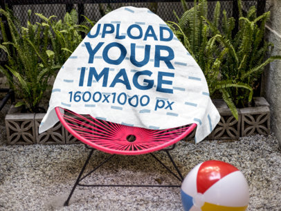 Beach Towel Template on a Pink Acapulco Chair Near Plants a14897