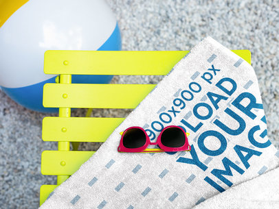Sunglasses on a Towel Mockup Lying Near a Beach Ball