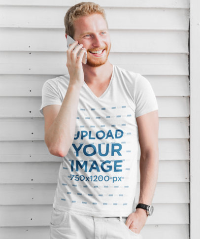 V-Neck Tee Mockup of a Happy Man Talking on the Phone