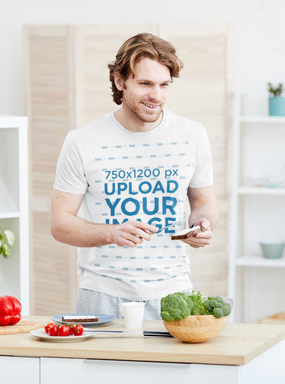 T-Shirt Mockup of a Man Making Breakfast at Home