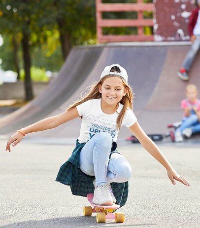 T-Shirt Mockup of a Cool Little Girl at a Skate Park