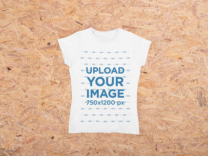 Mockup of a Women's T-Shirt on a Wood Fibre Surface m1167