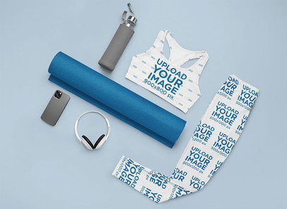 Flat Lay Mockup Featuring a Sports Bra and Leggings in a Fitness Setting