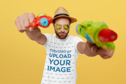 T-Shirt Mockup of a Man Holding Two Water Pistols 37652-r-el2