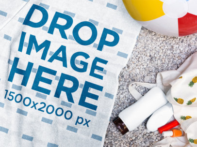 Towel Template Lying on the Floor with a Beach Ball and Accessories Beside it