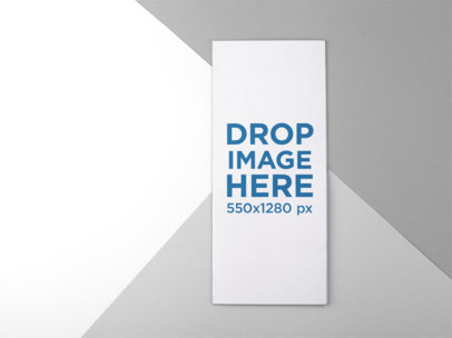 Closed Bifold Brochure Mockup Lying on a Three Colors Surface