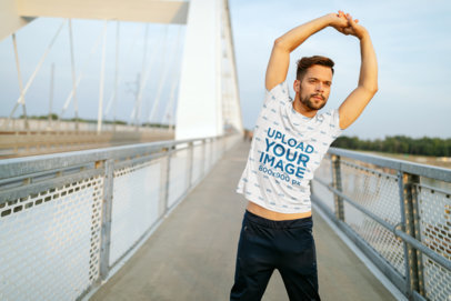Sublimated Tee Mockup Featuring a Man Stretching Before a Run 