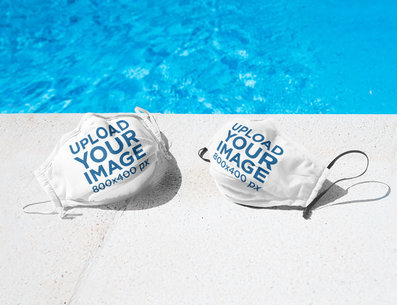 Mockup of Two Face Masks Placed by a Pool 46204-r-el2