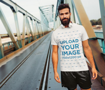T-Shirt Mockup Featuring a Bearded Jogger with Headphones 
