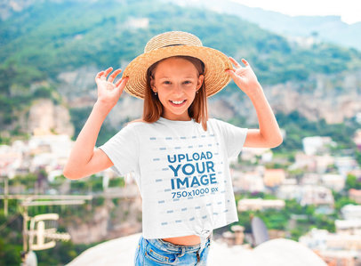 T-Shirt Mockup of a Little Girl Wearing a Hat