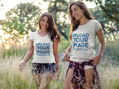 Two Women Wearing Different T-Shirts Mockup Having Fun While Walking Outdoors