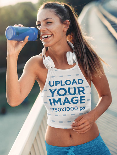Sublimated Crop Top Mockup of a Woman Drinking Water After a Run 