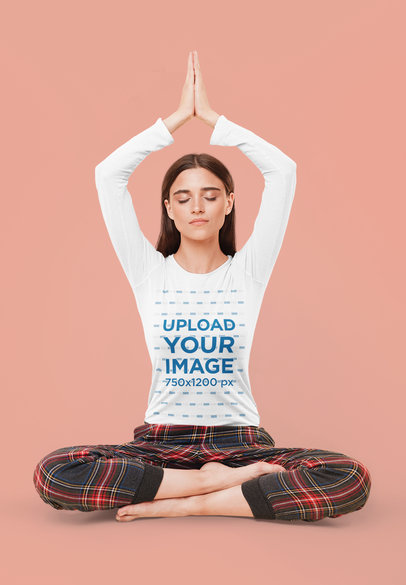 Long Sleeve Tee Mockup Featuring a Woman Doing Yoga in a Studio