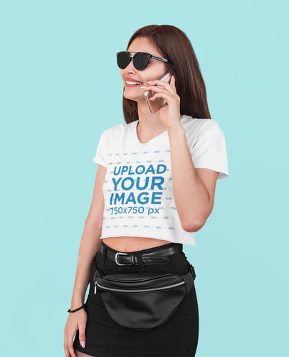 Crop Top Mockup of a Woman With Sunglasses Making a Call at a Studio 