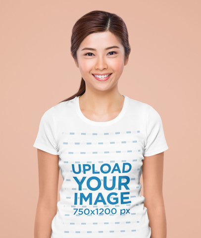 Mockup of a Young Woman Wearing a Basic T-Shirt at a Studio 