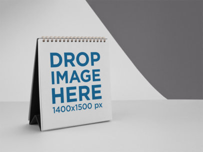 Template of a Calendar Standing on a Solid Surface Against a Bicolor Background a15220