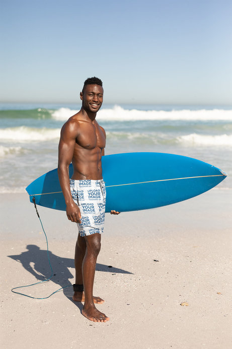 Swim Trunks Mockup of a Happy Man Holding a Surf Board 
