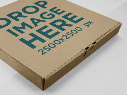 Closeup Mockup of a Pizza Box Lying on a Multicolor Surface