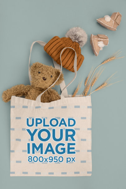 Tote Bag Mockup Featuring a Teddy Bear and Baby Garments m1137