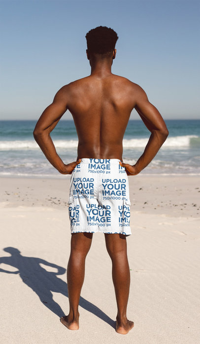 Back-View Swim Trunks Mockup Featuring a Man Standing at the Beach 40978-r-el2