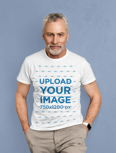 T-Shirt Mockup of a Senior Man Posing Against a Solid Color Backdrop 