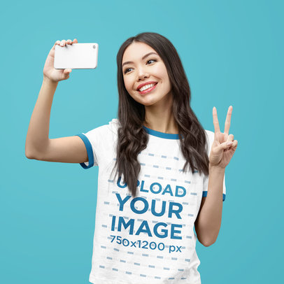Ringer T-Shirt Mockup Featuring a Happy Woman Posing Against a Solid Color Backdrop 40709-r-el2
