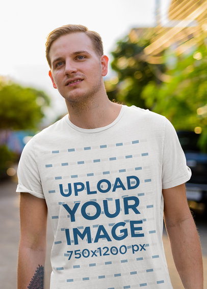 Mockup of a Tattooed Man Wearing a Tee with a Chest Pocket