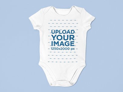 Baby Onesie Mockup Lying on a Flat Surface a15264