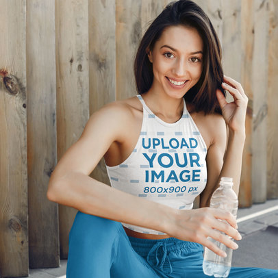 Mockup of a Happy Woman Wearing a Sublimated Crop Top Tank Top