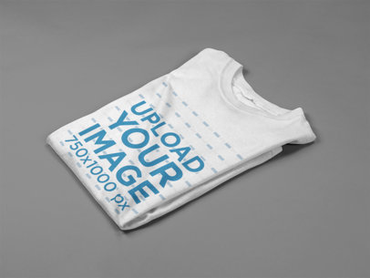 Mockup of a Men's Tshirt Folded on a Flat Surface