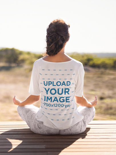 Back-View Mockup of a Woman in a Loose T-Shirt Meditating
