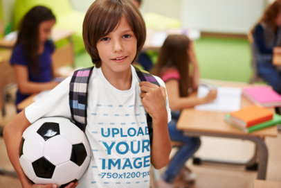 T-Shirt Mockup Featuring a Boy Carrying a Soccer Ball at School 38245-r-el2