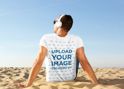 Back-View T-Shirt Mockup of a Man Listening to Music at the Beach