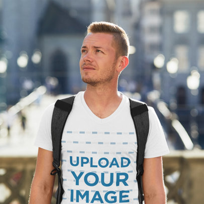 V-Neck T-Shirt Mockup Featuring a Man Traveling
