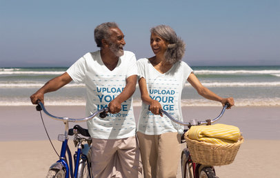 V-Neck T-Shirt Mockup of a Senior Couple Riding Bikes by the Beach