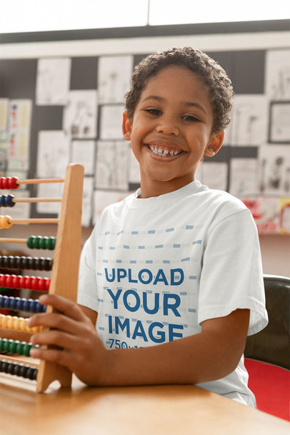 T-Shirt Mockup of a Happy Kid Holding an Abacus 