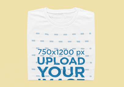 Mockup of a Folded Tee on a Customizable Color Backdrop